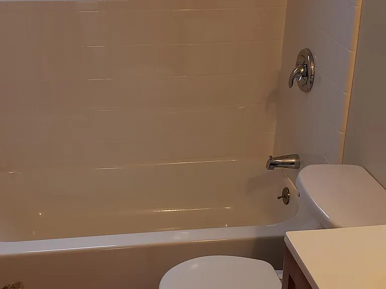 New shower & new tile. New full sized soaking tub