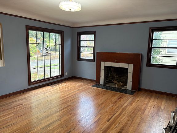Living room with working fireplace.