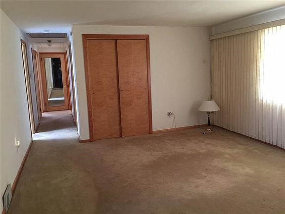 There are hardwood floors under the carpeting