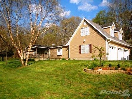3 car garage, a poured driveway and a huge yard!