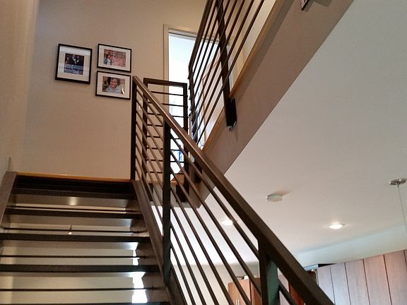 Steel and Hardwood Architectural Staircase open to all Level
