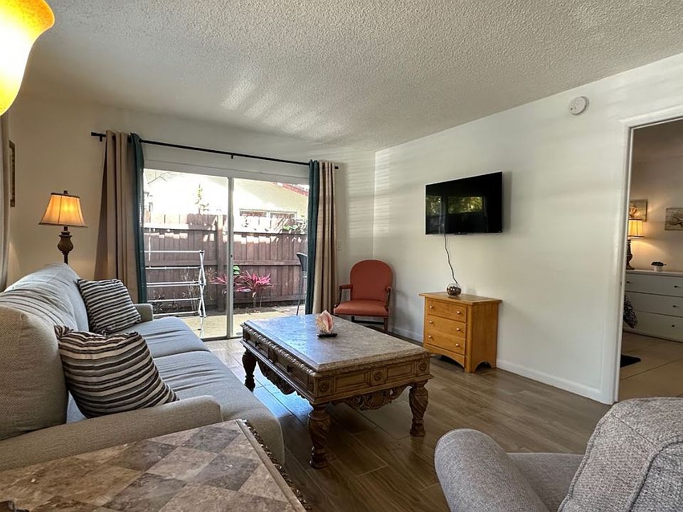 Living room with Master Bedroom entrance, and sliders to private patio.