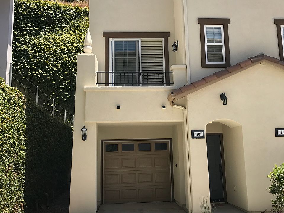 One open parking spot, garage parking, small balcony