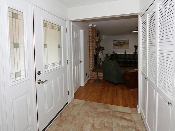 The leaded front door welcomes you.  Family room on the left, living room on the right.