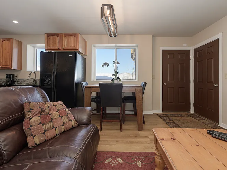 Front door and entry door to garage. Beautiful table and chairs for breakfast with a view of the valley, aspens.