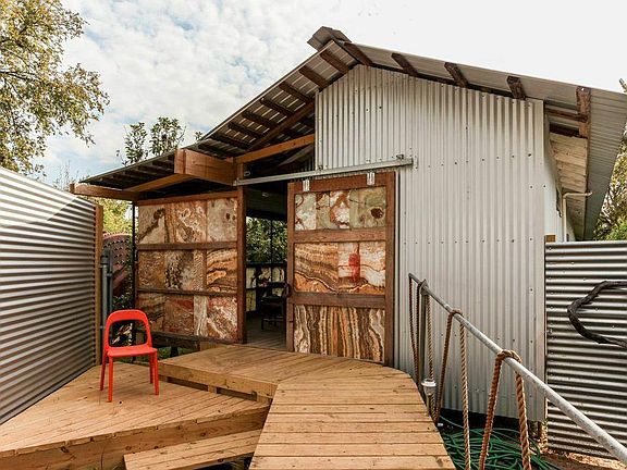 entrance to the house us decked all the way from street for