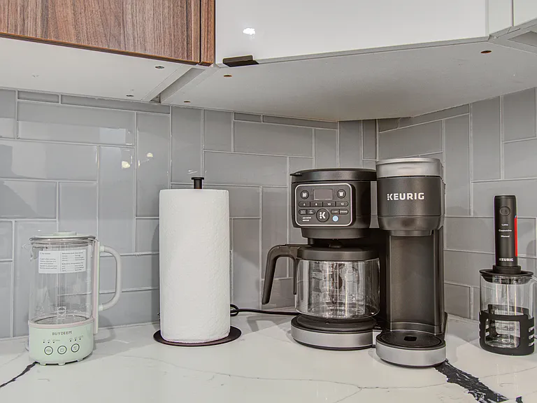 Spacious, fully equipped kitchen designed for both everyday cooking and entertaining. You'll find everything you need, including brand-new Henckels cookware, dinnerware, utensils, a Keurig coffee maker, and a traditional drip coffee maker.