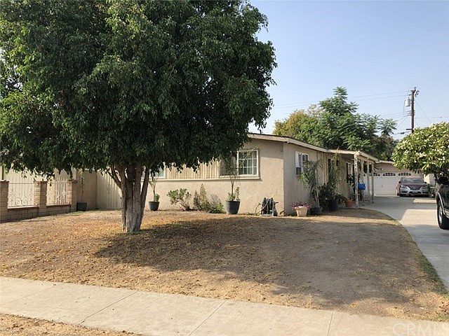 Quite large front yard, long driveway to 2 car detached garage