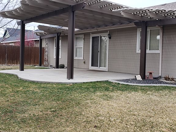 Extra large patio, pergola covered.