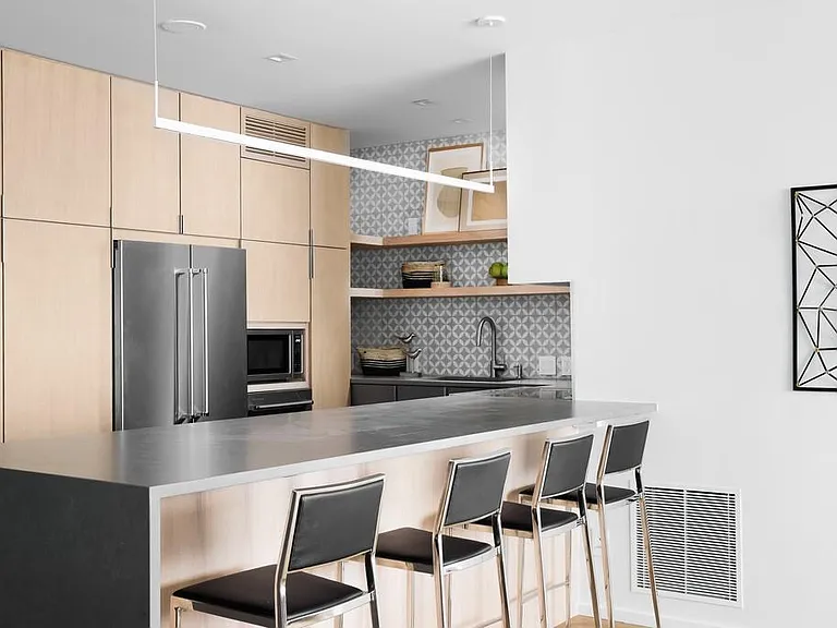 Kitchen complete with cabinet storage maximized with innovative Rev-a-Shelf pull-out organizers.