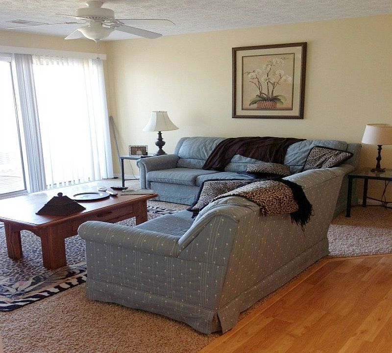Den with new carpet, balcony