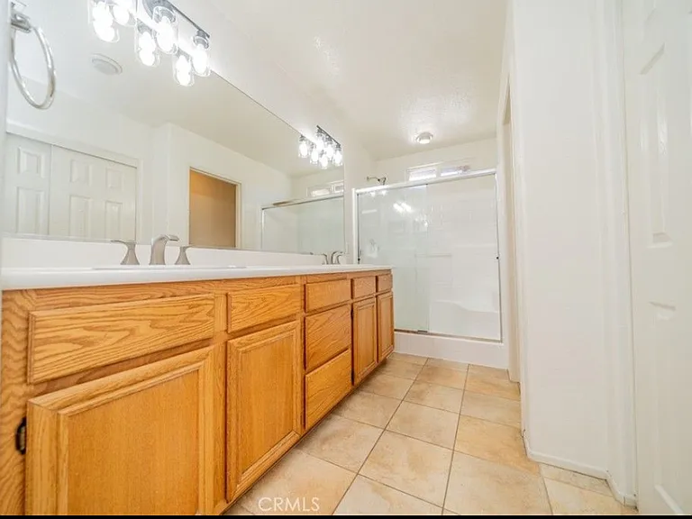 This picture shows the Master bathroom. There are two full bathrooms upstairs (the master bathroom and the hall bathroom) and a half bathroom downstairs.
