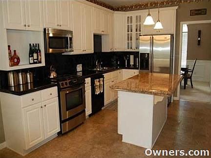 Kitchen with granite and stainless appliances
