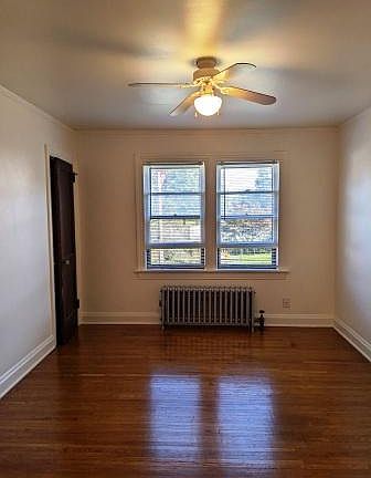 Lighted living room and oak hardwood floor