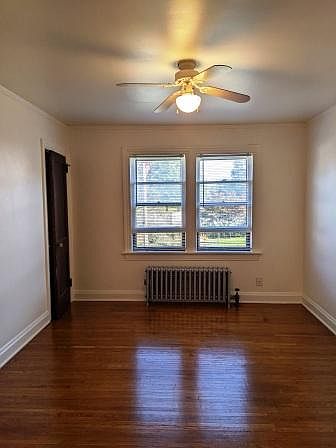 Lighted living room and oak hardwood floor