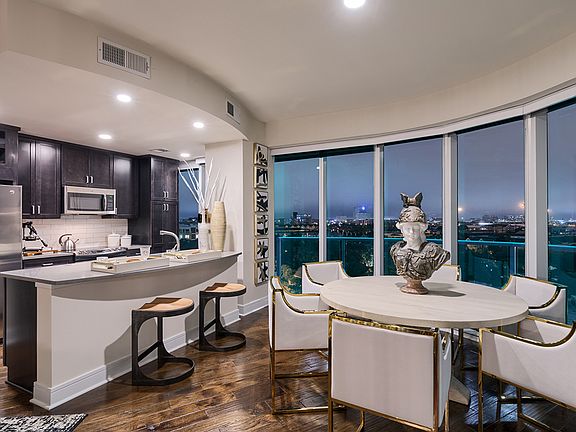Kitchen Living room with stunning views, hardwood flooring and floor to ceiling windows
