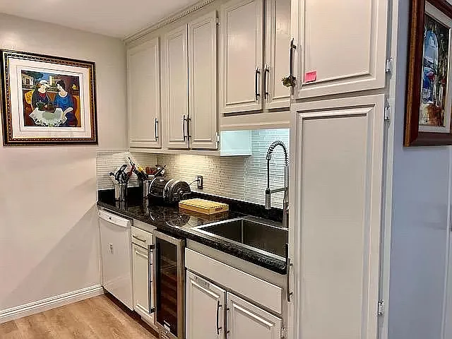 Kitchen - new farm sink and backsplash. New wine cooler.