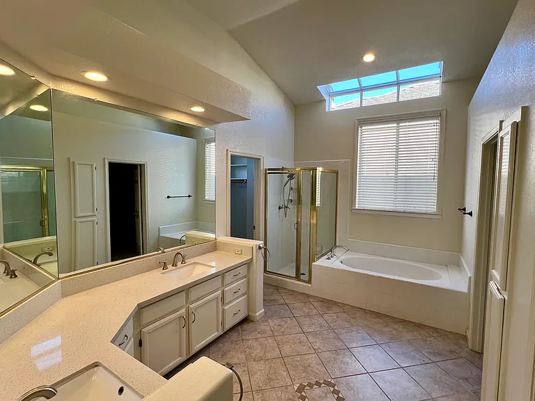 Master Bath with two separate walk-in closets