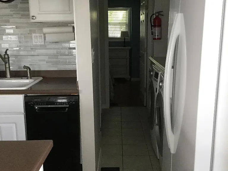 Kitchen to laundry to master bedroom