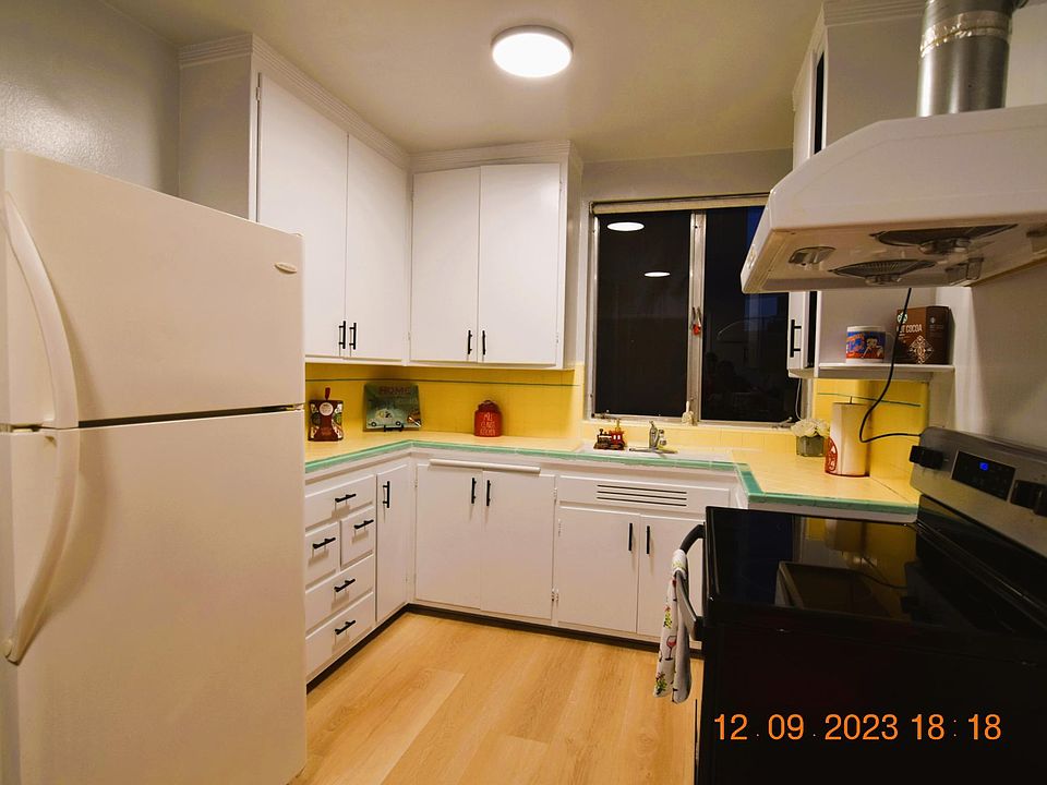New stove, new paint on kitchen cabinets' doors with new handles. Inside cabinets have real wood and lots shelvings. Good size refrigerator with freezer on the top.