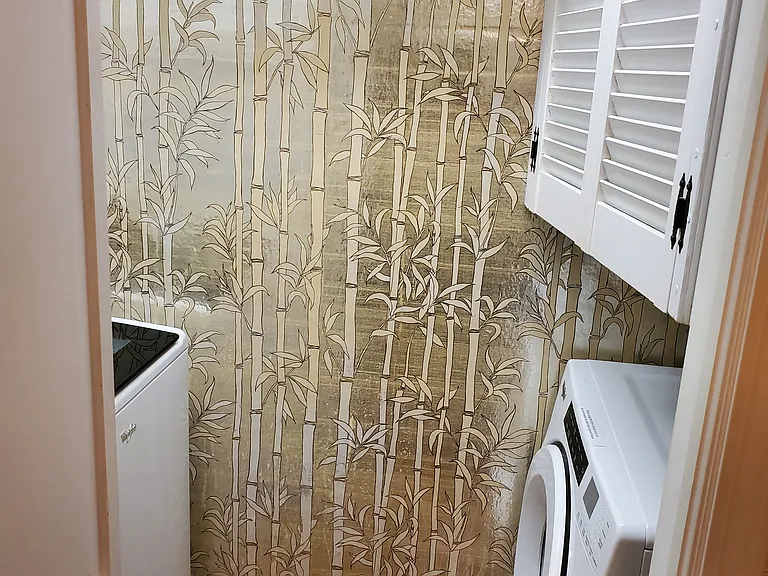 Full sized washer and dryer included within unit