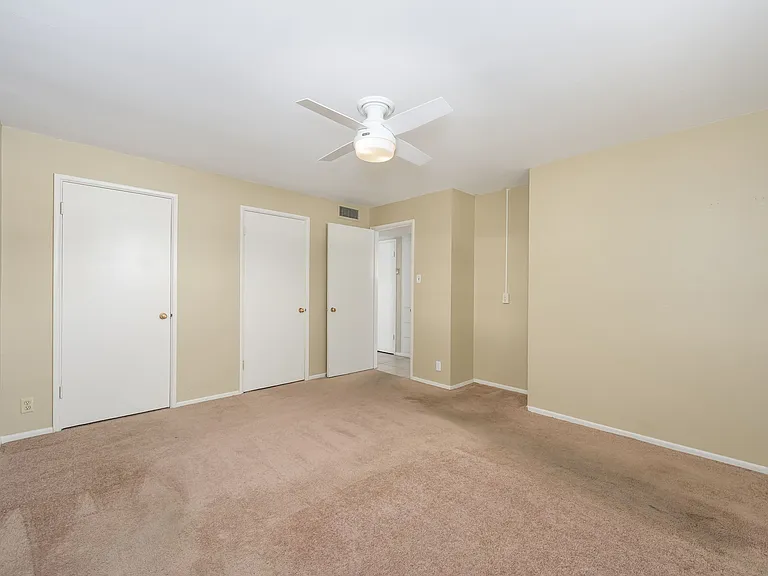 Primary bedroom with double door passthrough closet