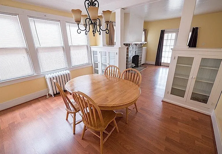Gorgeous dining room with china closets, refinish ward wood floors, beautiful chandelier. Lots of light.