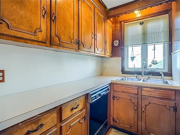 pantry with sink and dishwasher