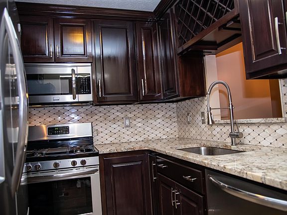 Updated kitchen with stainless steel appliances.