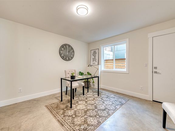 First floor bedroom past the garage works great as a home office for today's work from home lifestyle or as a workout / hobby room. Room has polished concrete flooring and its own separate side door for easy access.
