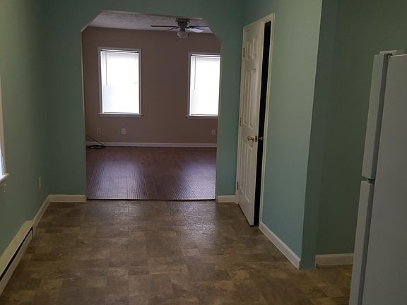 Eat in kitchen with window looking into living room on west