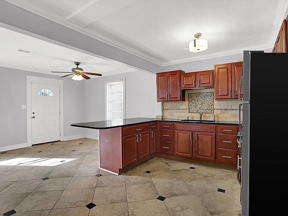 Large open design kitchen with stainless steel appliances