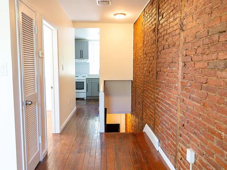 Hallway looking towards kitchen and entrance