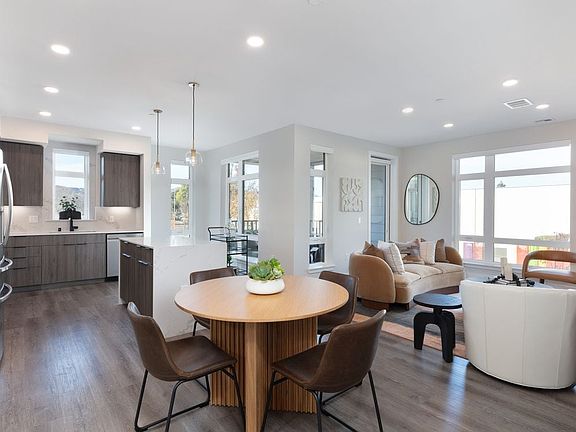 Signature Collection living and dining areas with hard surface flooring throughout