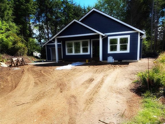Photo of builder's previous build and not exact of home under construction.