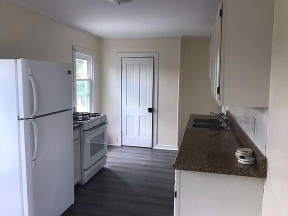 kitchen with 3 windows and pantry