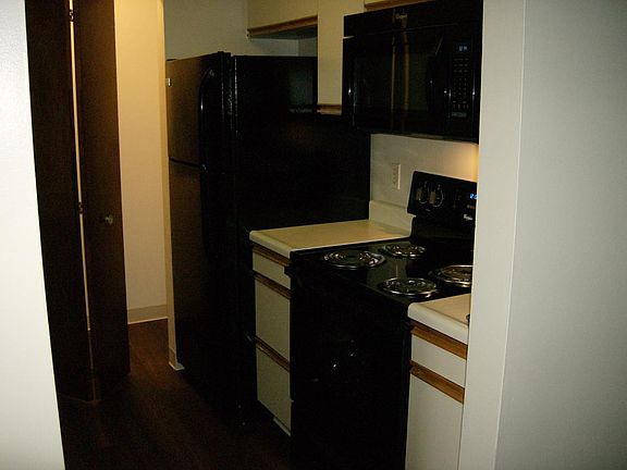 Kitchen has a Laundry area that has a Stackable Washer & Dry