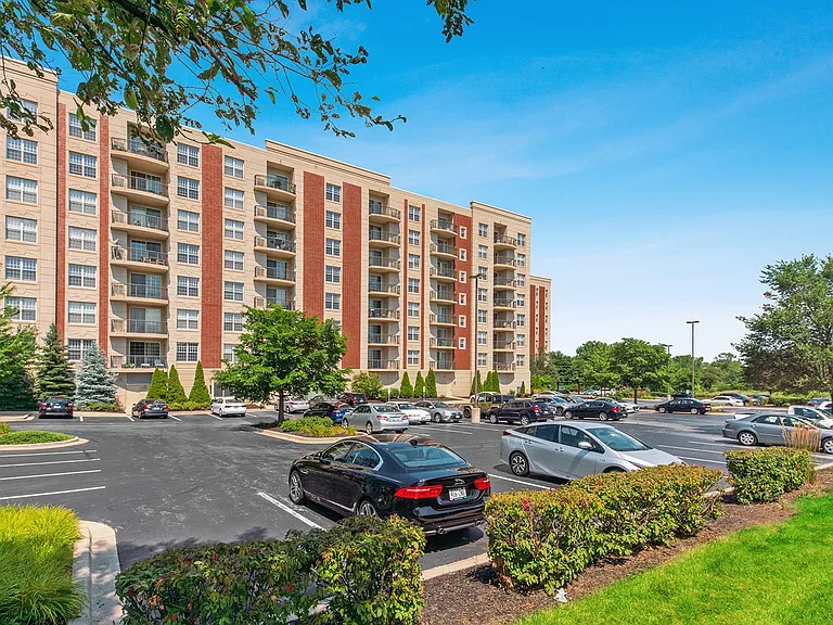 Well-maintained parking lot and mid-rise building exterior