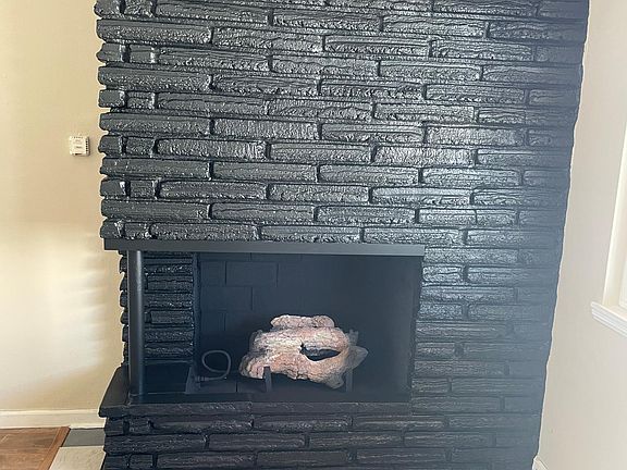 Newly painted and tiled fireplace