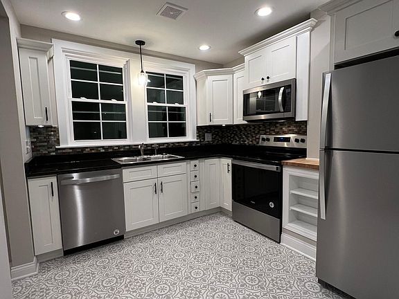 All the Best! Premium custom cabinetry, granite counters, stainless appliances, lighting, tile flooring and backsplash.
