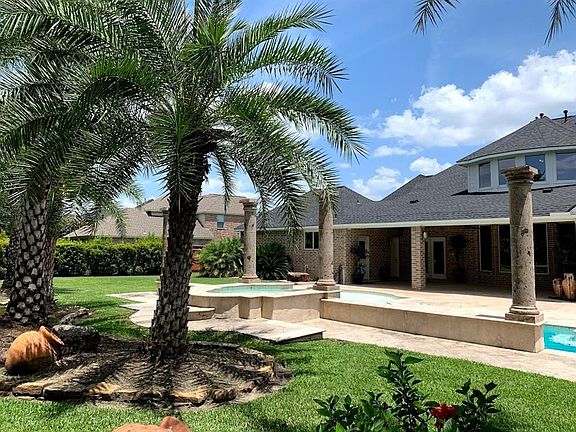 The tropical feel of this back yard space will make you want to be outdoors all year round.