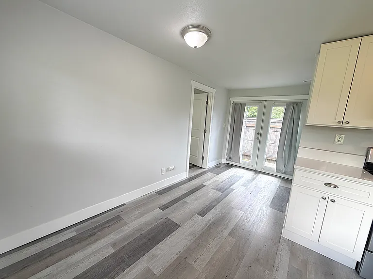 Floor is LVP throughout. Door to the left is bedroom