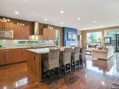 This space was made for entertaining! An open floor plan keeps you connected with guest and encourages gathering at the sprawling island with gorgeous granite counters.