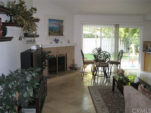 Family Room with Traditional Fireplace and Travertine Floori
