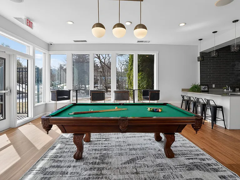 Welcome to Bay Ridge at Nashua Apartments, where modern living meets leisure. Enjoy a stylish game room with stunning views, perfect for relaxation and socializing. Elevate your lifestyle todayschedule a tour with us!