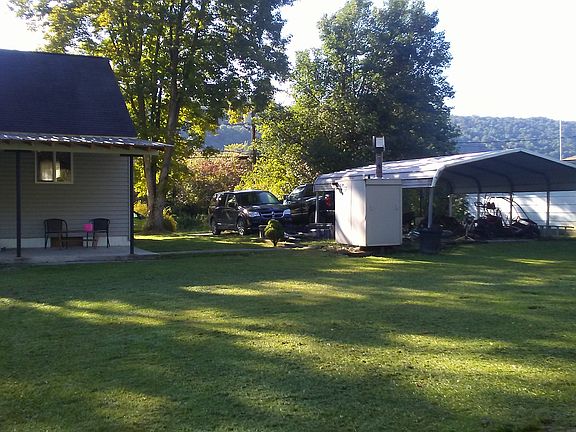 Carport/outdoor furnace