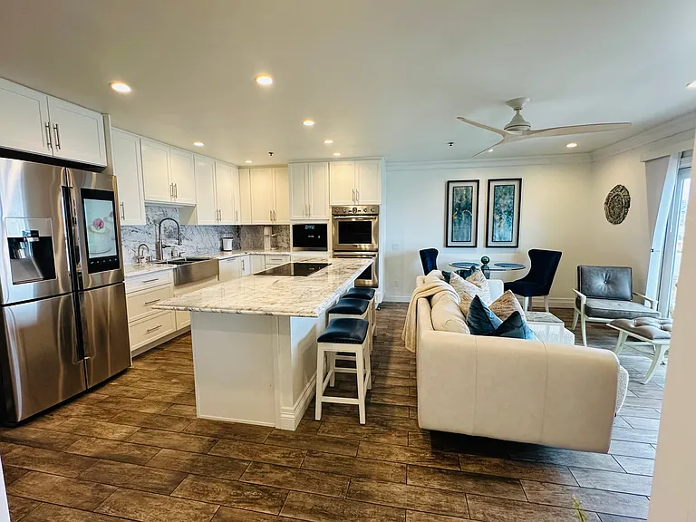Condo is curated with high-end appliances and furniture.