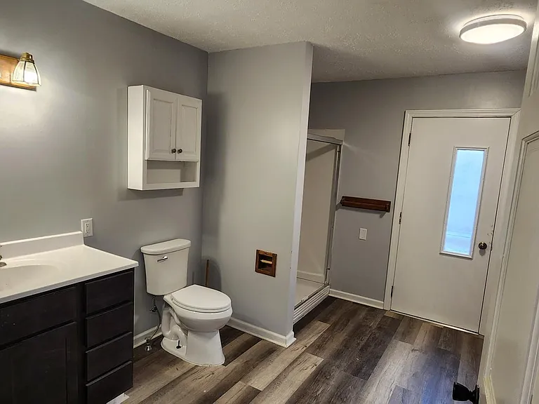 This house has 4 entrances. This is the side entrance leading to spacious full bathroom with utility room