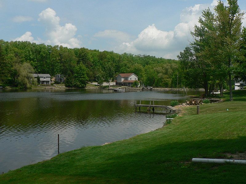 Association Clubhouse
						:
						View across lake of clubhouse from cottage back porch