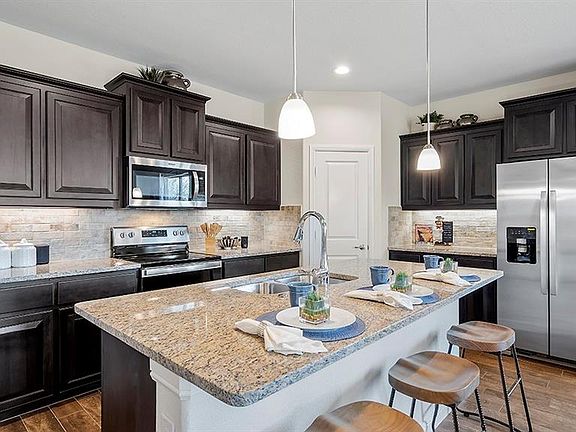 Photos shown here may not depict the specified home & features included are for illustration purposes only